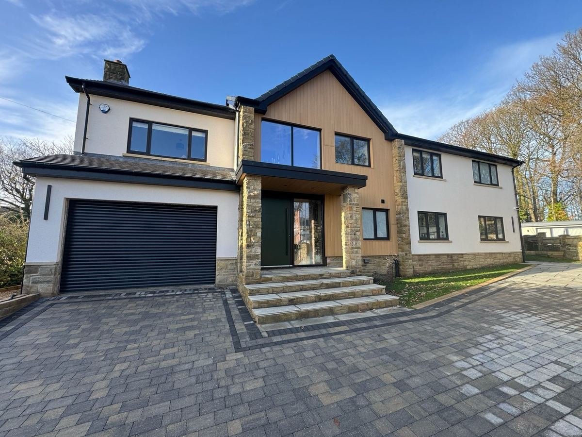 Front of the house in Adel, Leeds after silicone render, with cladding to the front