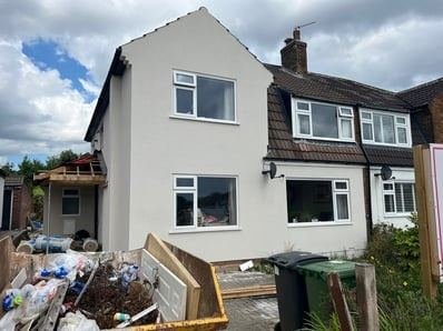 View of the house in Horsforth, Leeds after through-coloured render