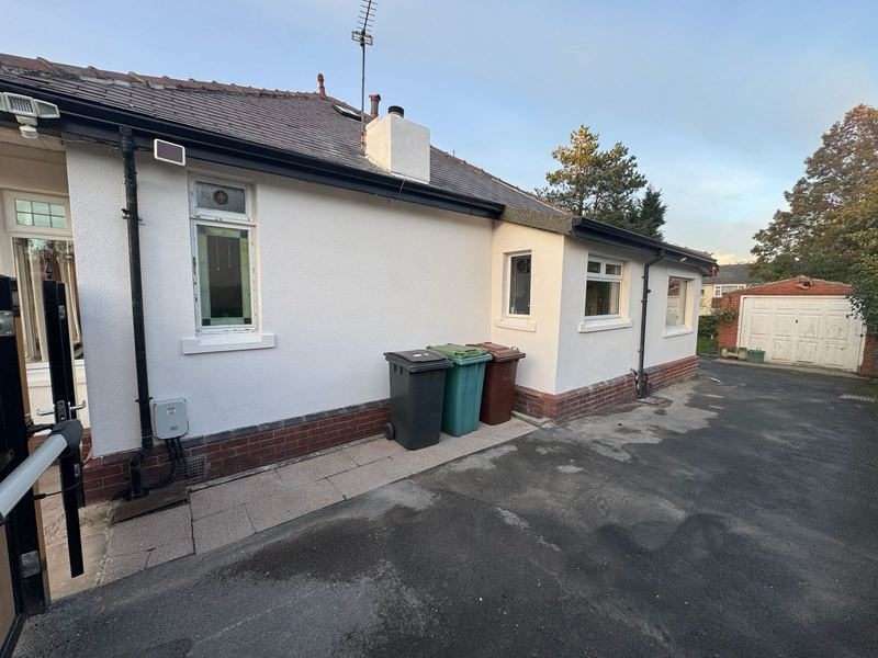 Side of the bungalow in Pudsey, Leeds after silicone render
