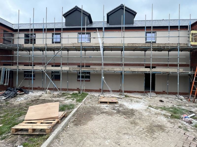 View of the nursing home in Blackburn after rendering, with the scaffold still up