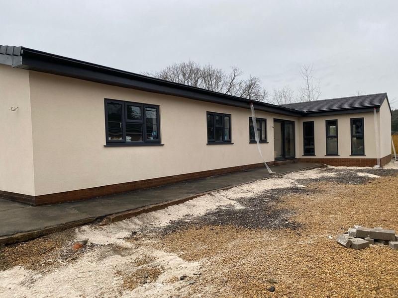 Side of the bungalow in Wakefield after monocouche render